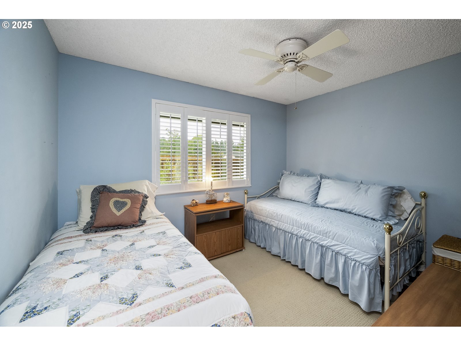 490 Southwest Nancy Avenue Gresham, OR 97030 - Photo 25 of 37 a bedroom with a bed and a ceiling fan