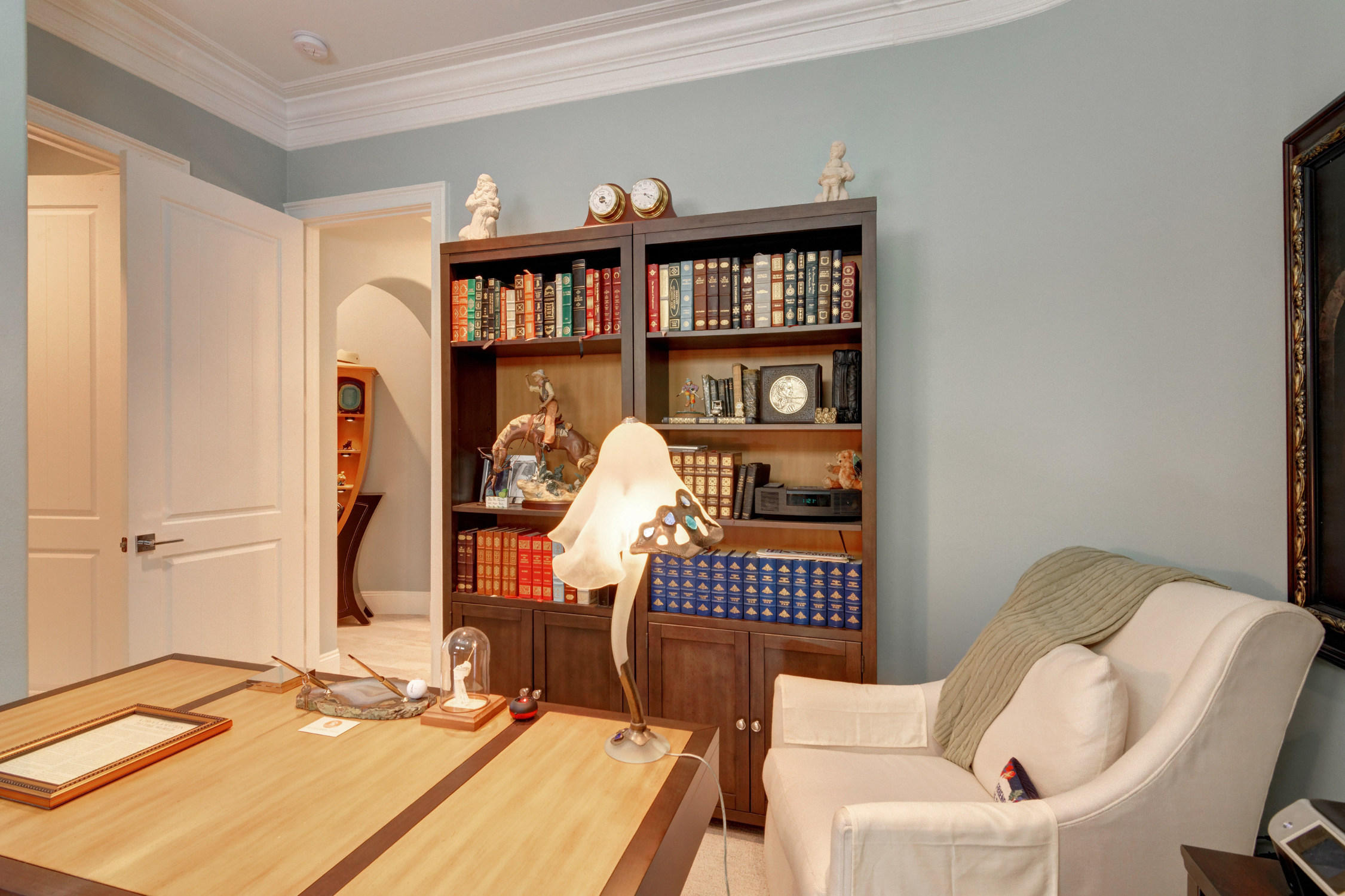 1922 Baytowne Loop Miramar Beach, FL 32550 - Photo 13 of 65 a living room with furniture a rug and a book shelf