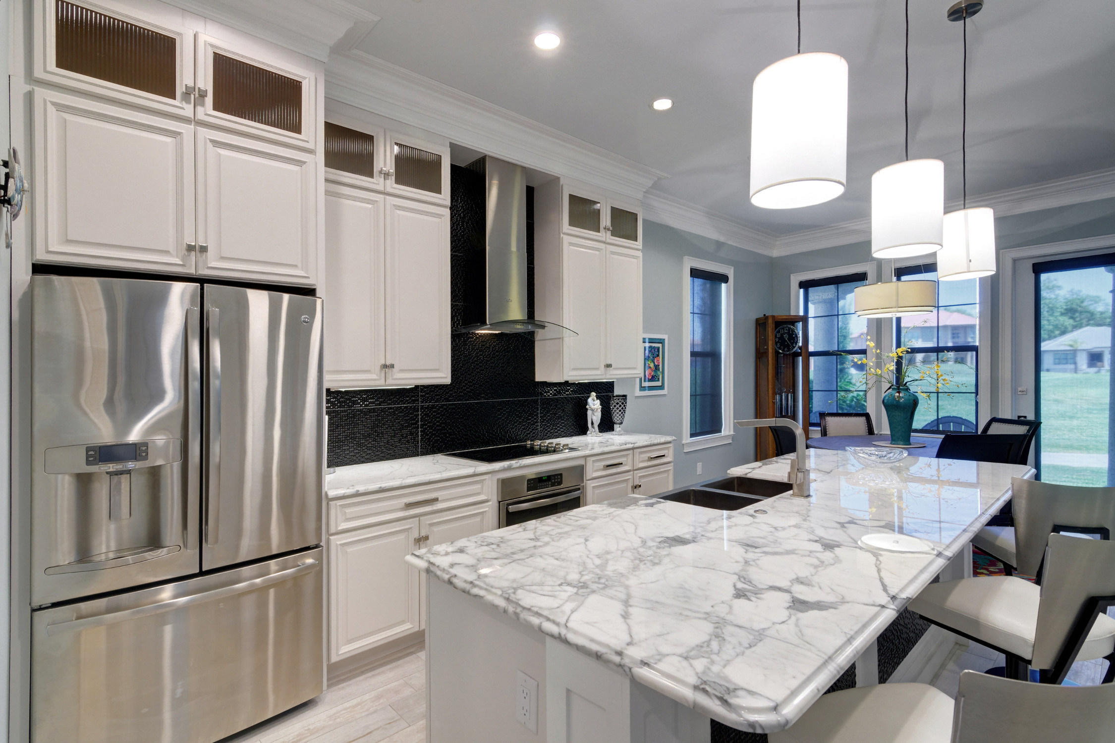 1922 Baytowne Loop Miramar Beach, FL 32550 - Photo 15 of 65 a kitchen with stainless steel appliances granite countertop a refrigerator a oven a sink and white cabinets