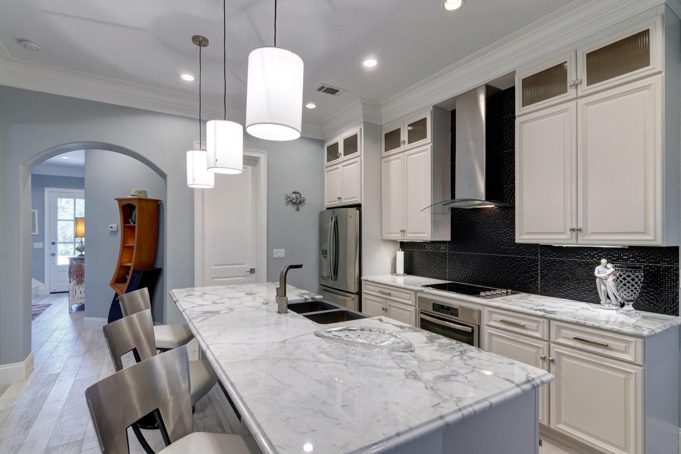 1922 Baytowne Loop Miramar Beach, FL 32550 - Photo 18 of 65 a kitchen with stainless steel appliances kitchen island granite countertop a stove a sink a refrigerator and a cabinets