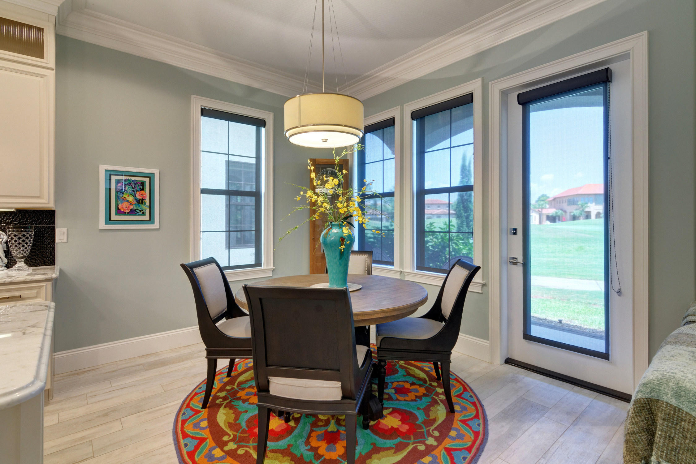 1922 Baytowne Loop Miramar Beach, FL 32550 - Photo 21 of 65 a dining room with furniture a chandelier and wooden floor