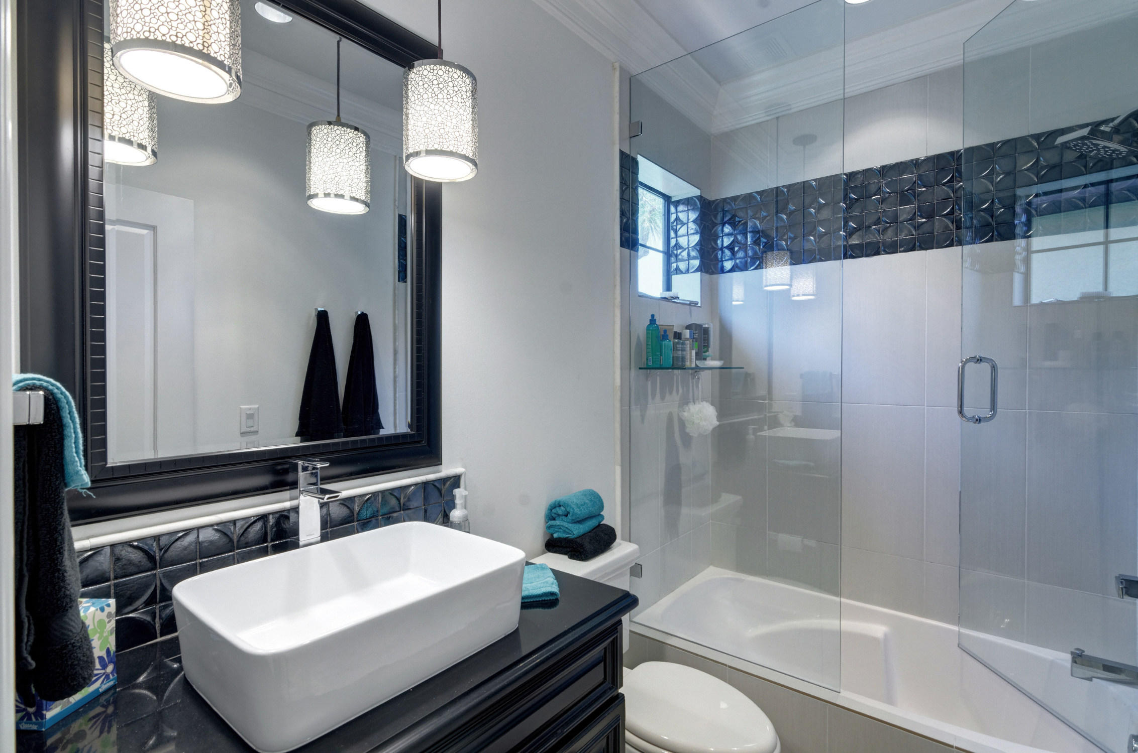 1922 Baytowne Loop Miramar Beach, FL 32550 - Photo 48 of 65 a bathroom with a sink a toilet and shower