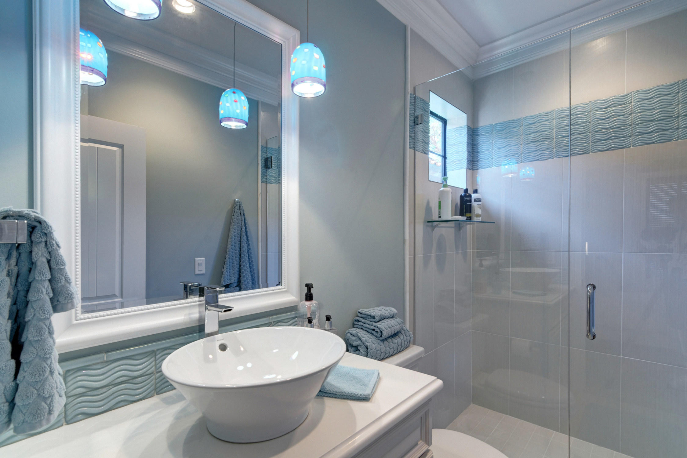 1922 Baytowne Loop Miramar Beach, FL 32550 - Photo 52 of 65 a bathroom with a sink a toilet and shower