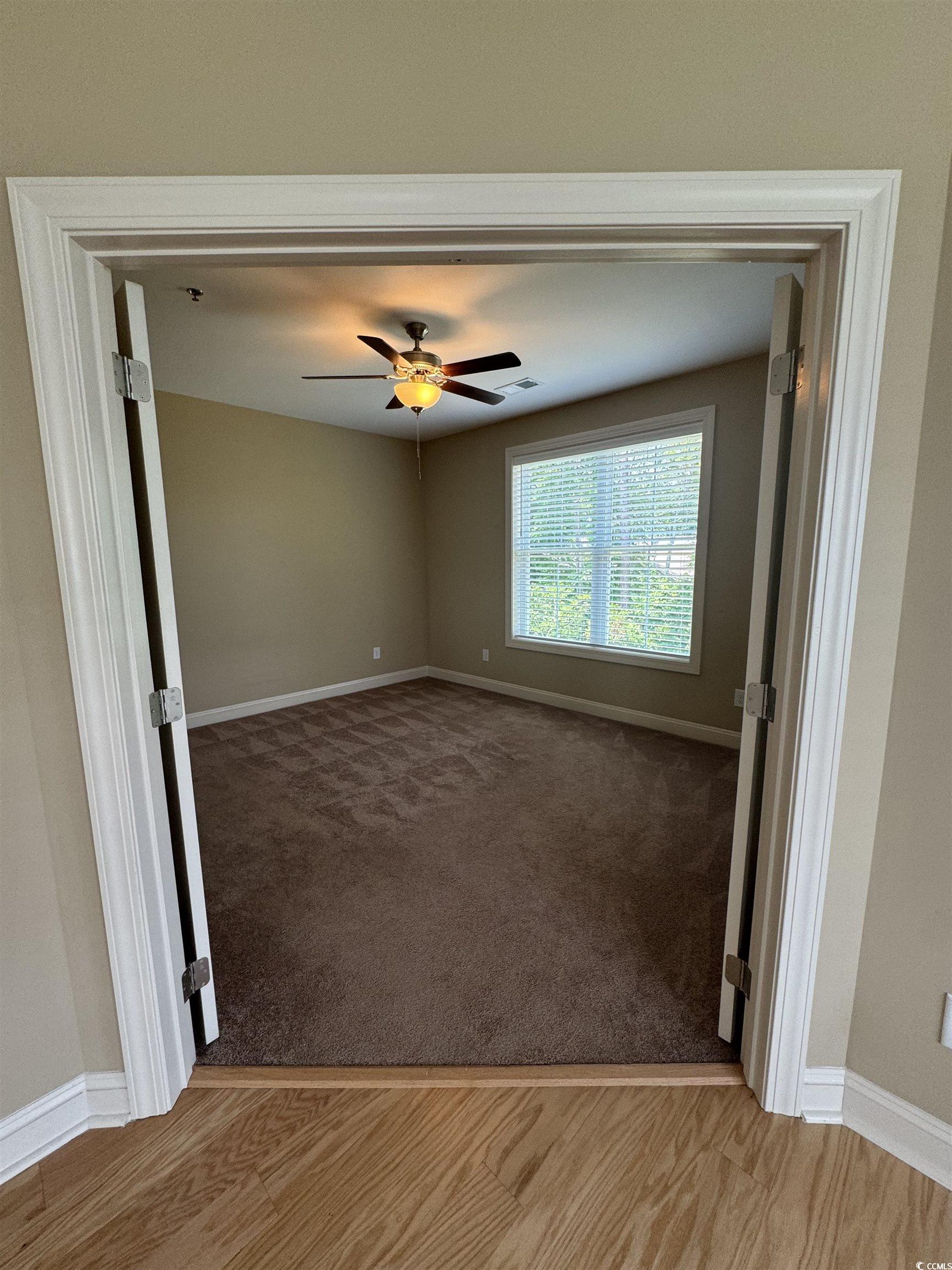 144 Puffin Drive, Unit 2E Pawleys Island, SC 29585 - Photo 11 of 17 Spare room with a ceiling fan and light wood-style flooring