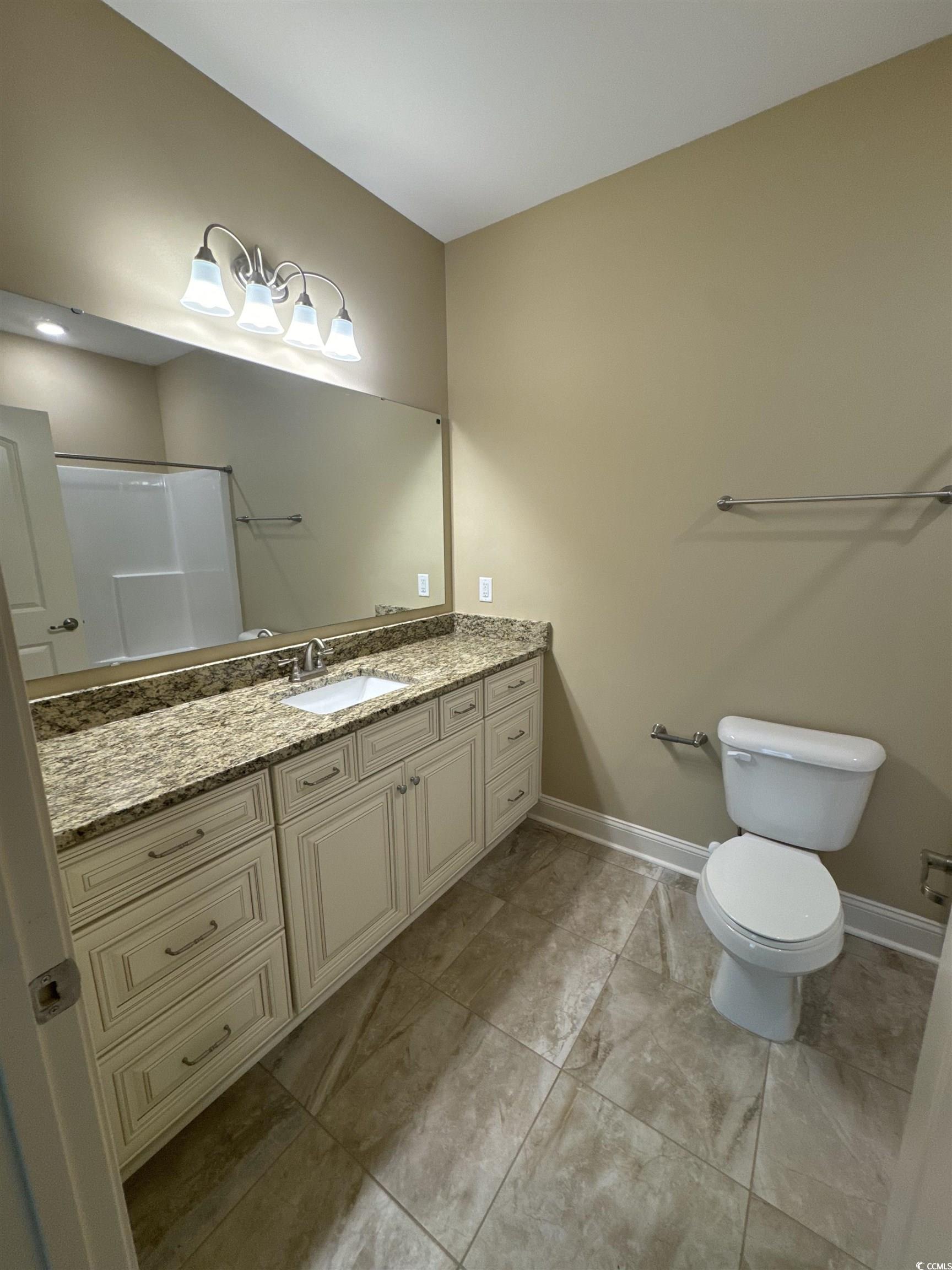 144 Puffin Drive, Unit 2E Pawleys Island, SC 29585 - Photo 13 of 17 Bathroom featuring vanity and baseboards