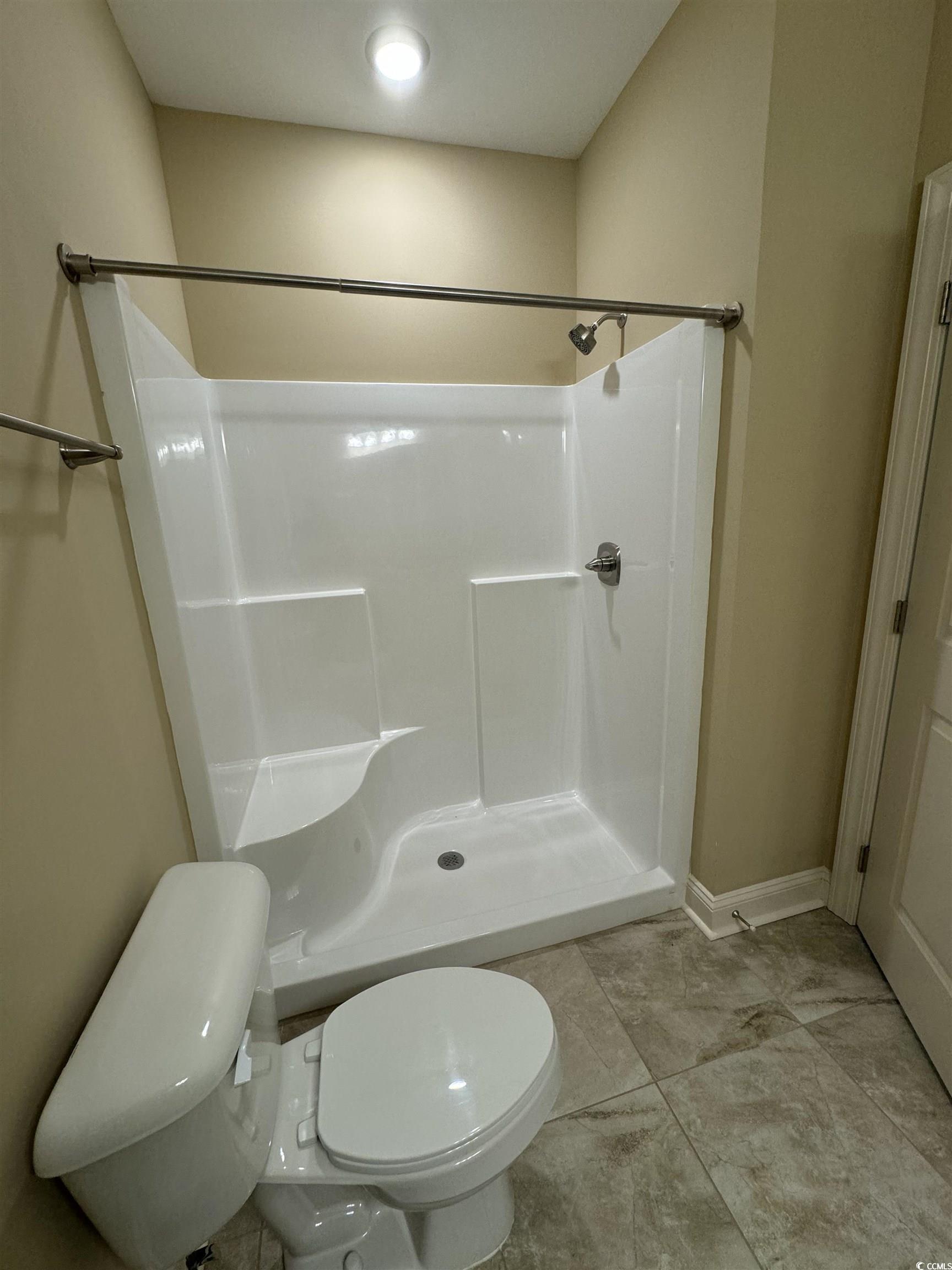 144 Puffin Drive, Unit 2E Pawleys Island, SC 29585 - Photo 14 of 17 Full bath with a shower stall and toilet
