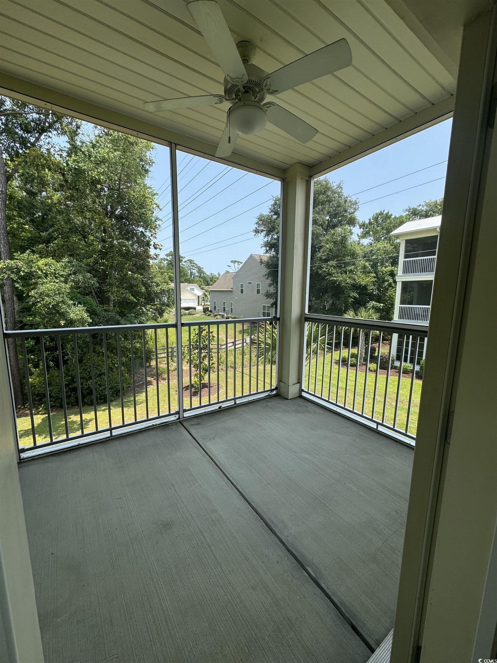 144 Puffin Drive, Unit 2E Pawleys Island, SC 29585 - Photo 15 of 17 Balcony with ceiling fan