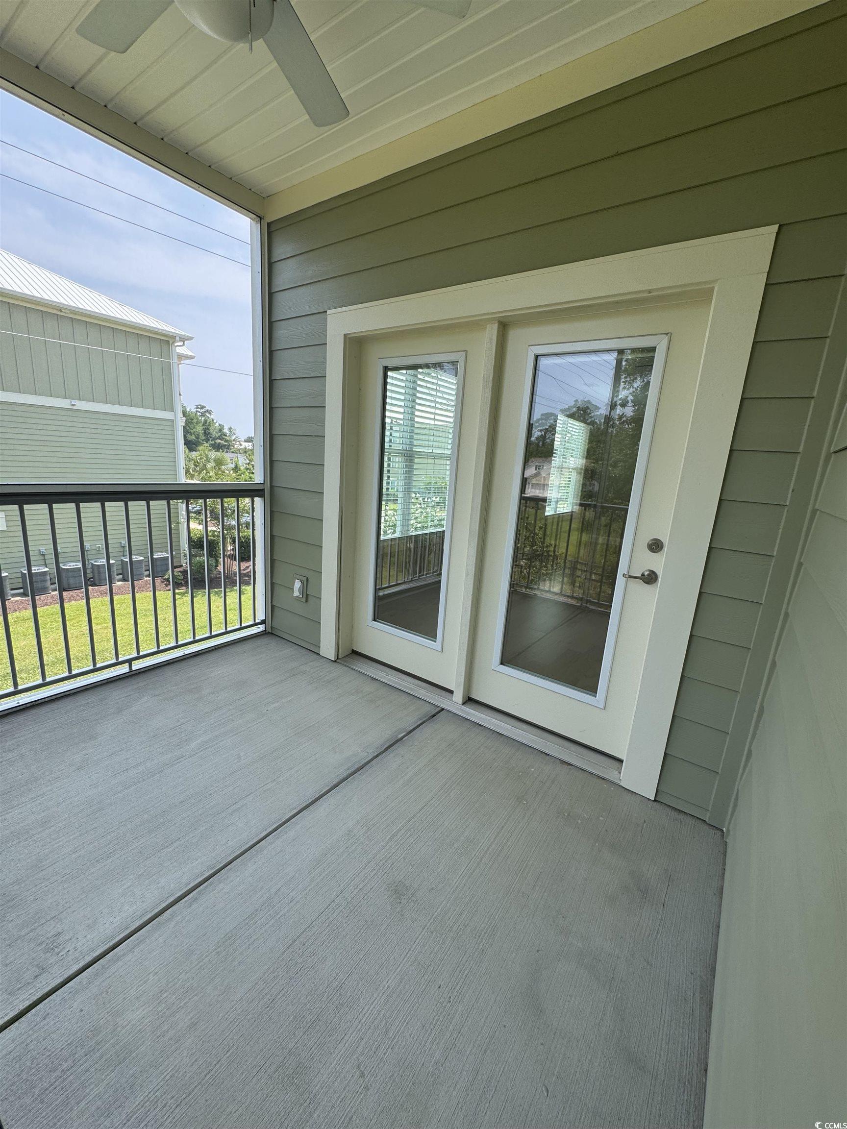144 Puffin Drive, Unit 2E Pawleys Island, SC 29585 - Photo 16 of 17 Balcony featuring a ceiling fan