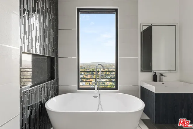 a bathroom with a bathtub and a sink