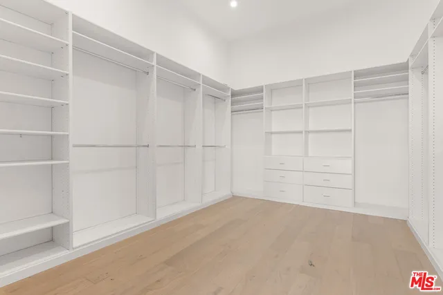a view of an empty walk in closet