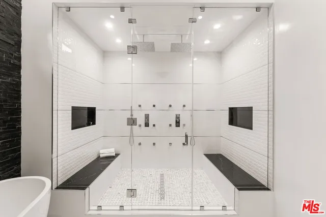 a bathroom with a bathtub and a sink