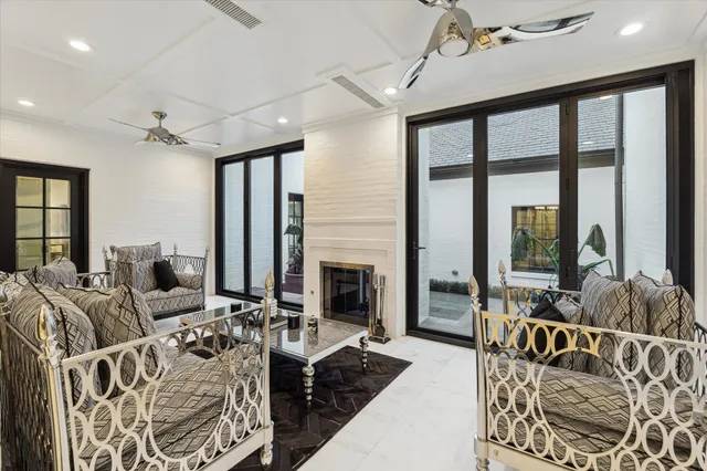 a living room with furniture fireplace and flat screen tv