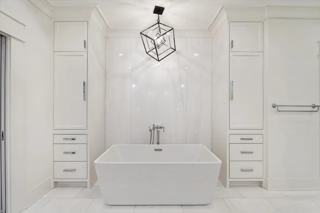 a bathroom with a bathtub and shower