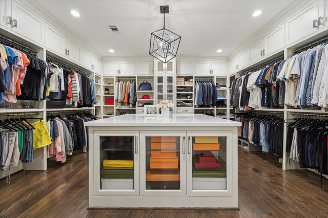 a view of a living room with furniture and wooden floor