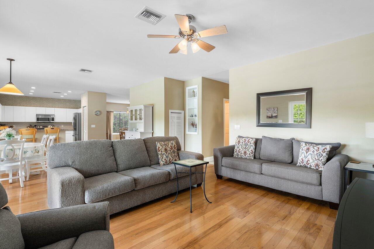 11842 Island Lakes Lane Boca Raton, FL 33498 - Photo 19 of 49 a living room with furniture and a large window