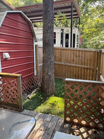 a view of backyard with cabin