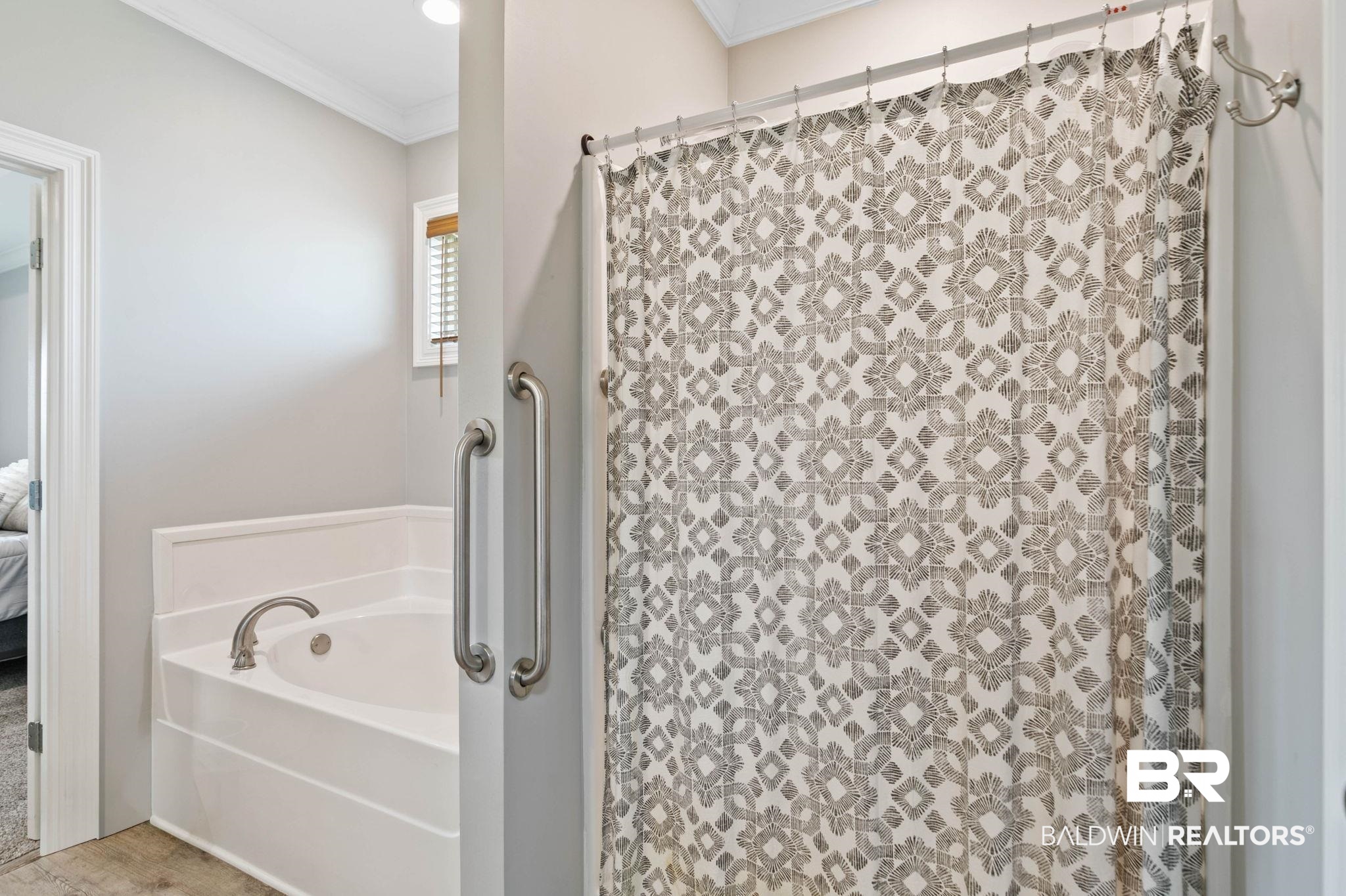 9388 Pembrook Loop Fairhope, AL 36532 - Photo 37 of 53 Ensuite bathroom featuring a bath, crown molding, and a shower with shower curtain