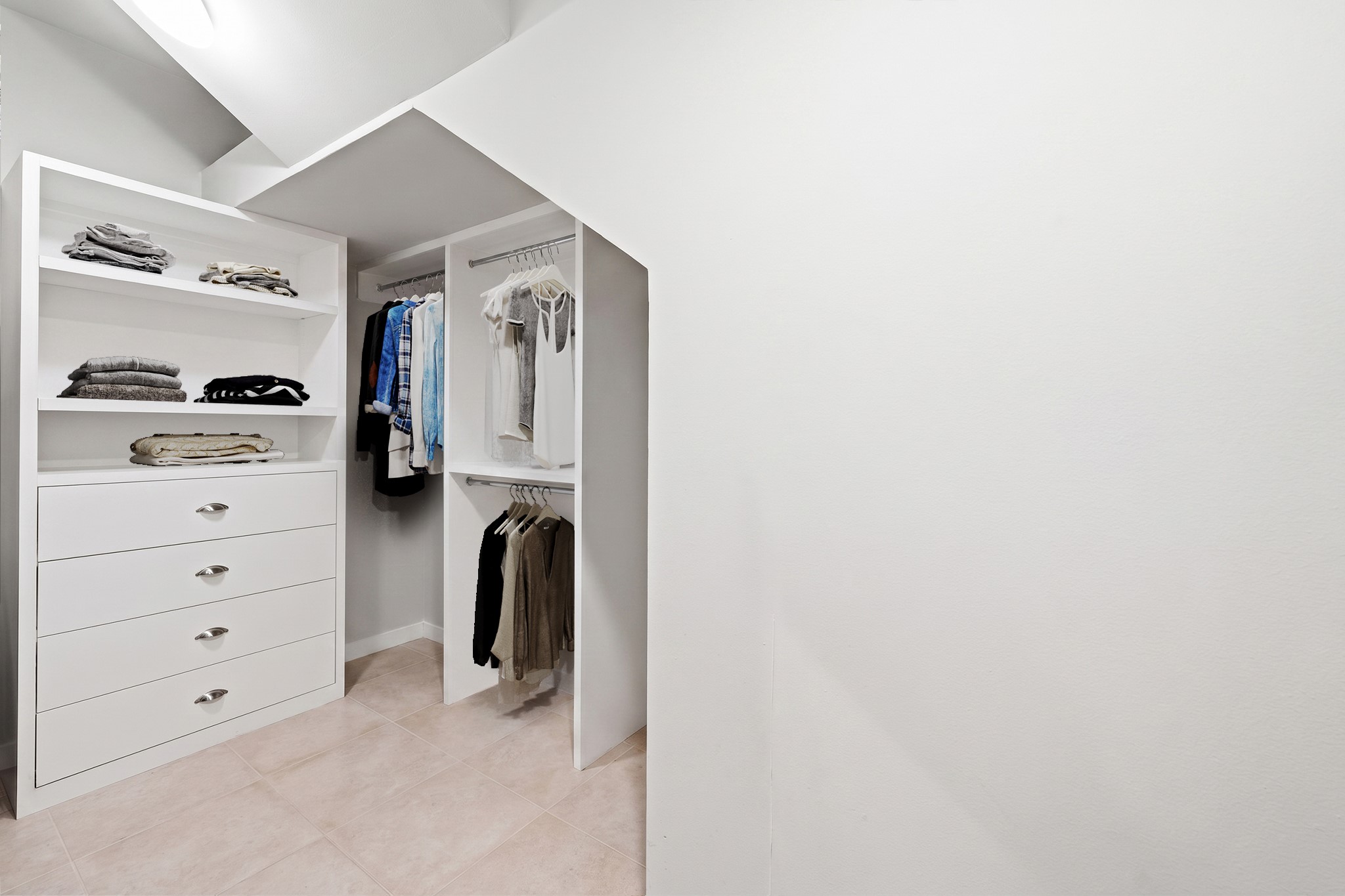 1820 Palm Street Houston, TX 77004 - Photo 33 of 47 a view of walk in closet with clothes and shoes