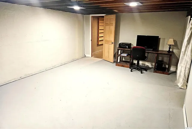 a view of a workspace with furniture