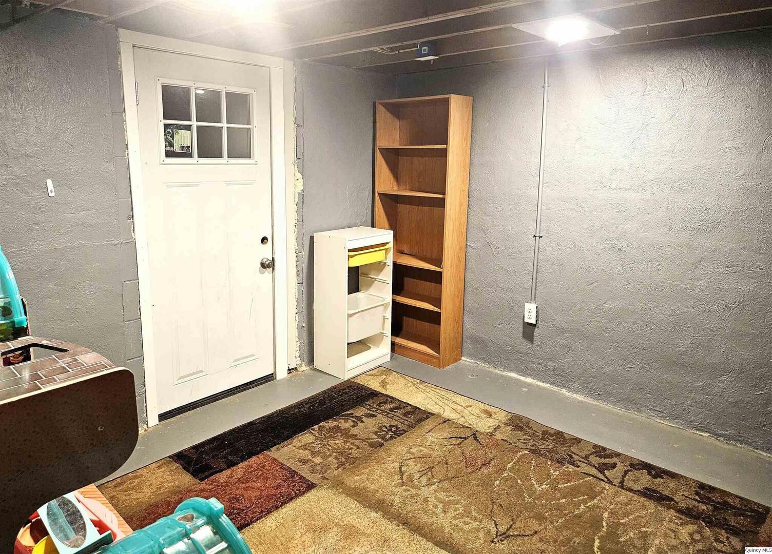 803 Maas Road Quincy, IL 62305 - Photo 22 of 28 a bedroom with a bed and a dresser