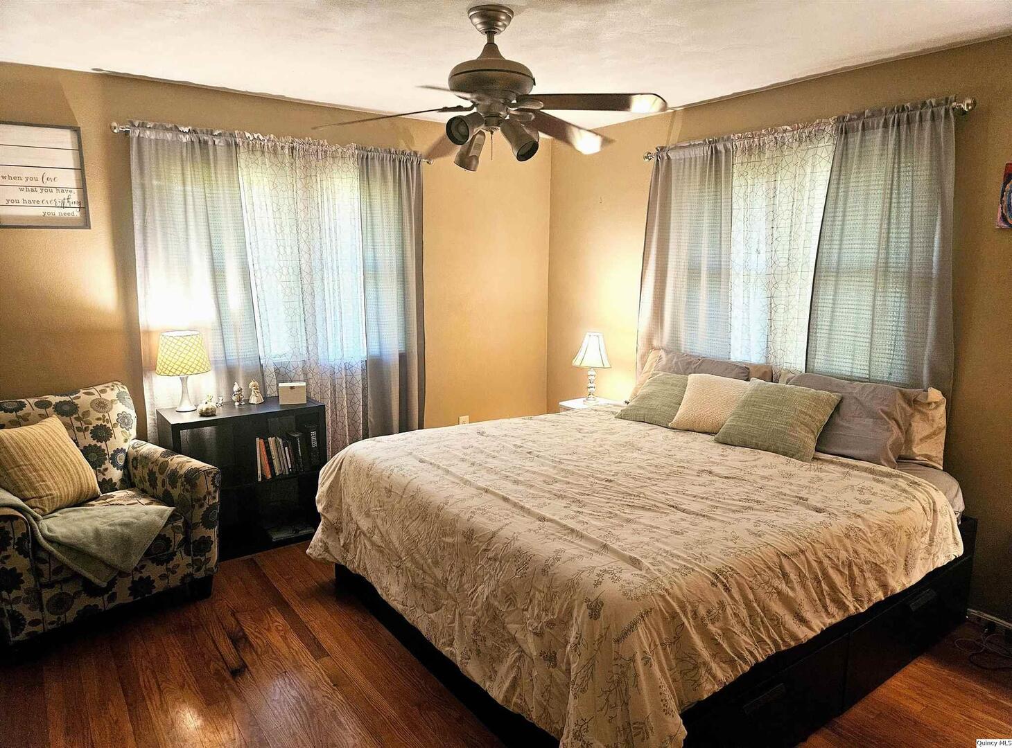 803 Maas Road Quincy, IL 62305 - Photo 5 of 28 a bedroom with a bed and wooden floor