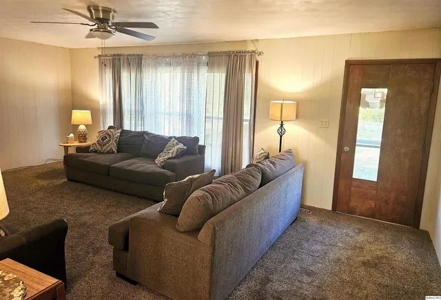 a living room with furniture and a window