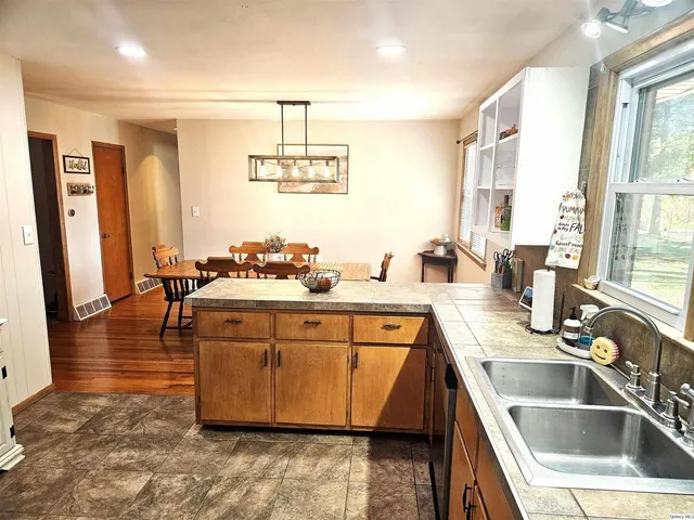 a kitchen with a sink and a refrigerator
