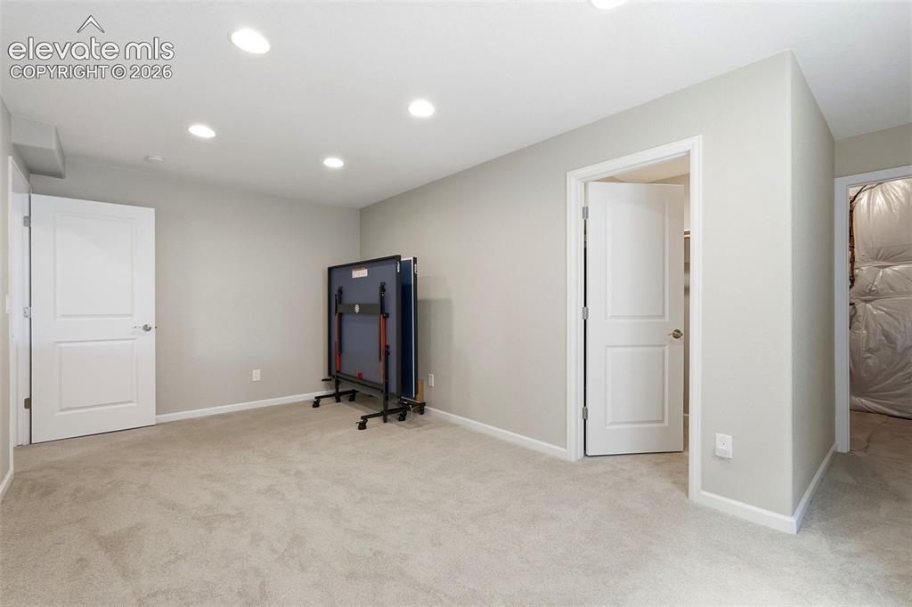 1394 Promontory Bluff View Colorado Springs, CO 80921 - Photo 39 of 47 a view of a room with gym equipment