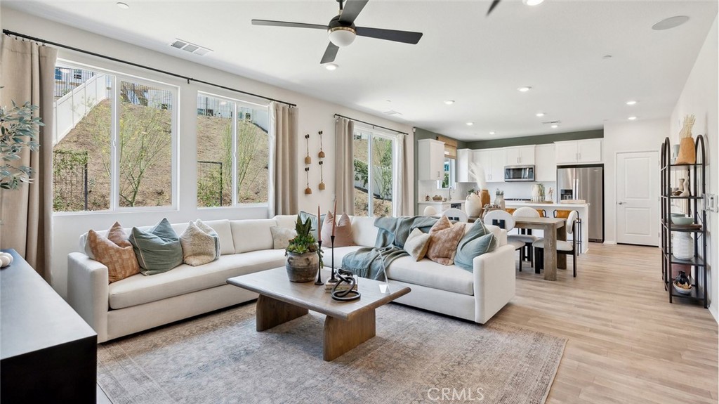 11392 Forge Road Corona, CA 92883 - Photo 3 of 24 a living room with furniture and a large window