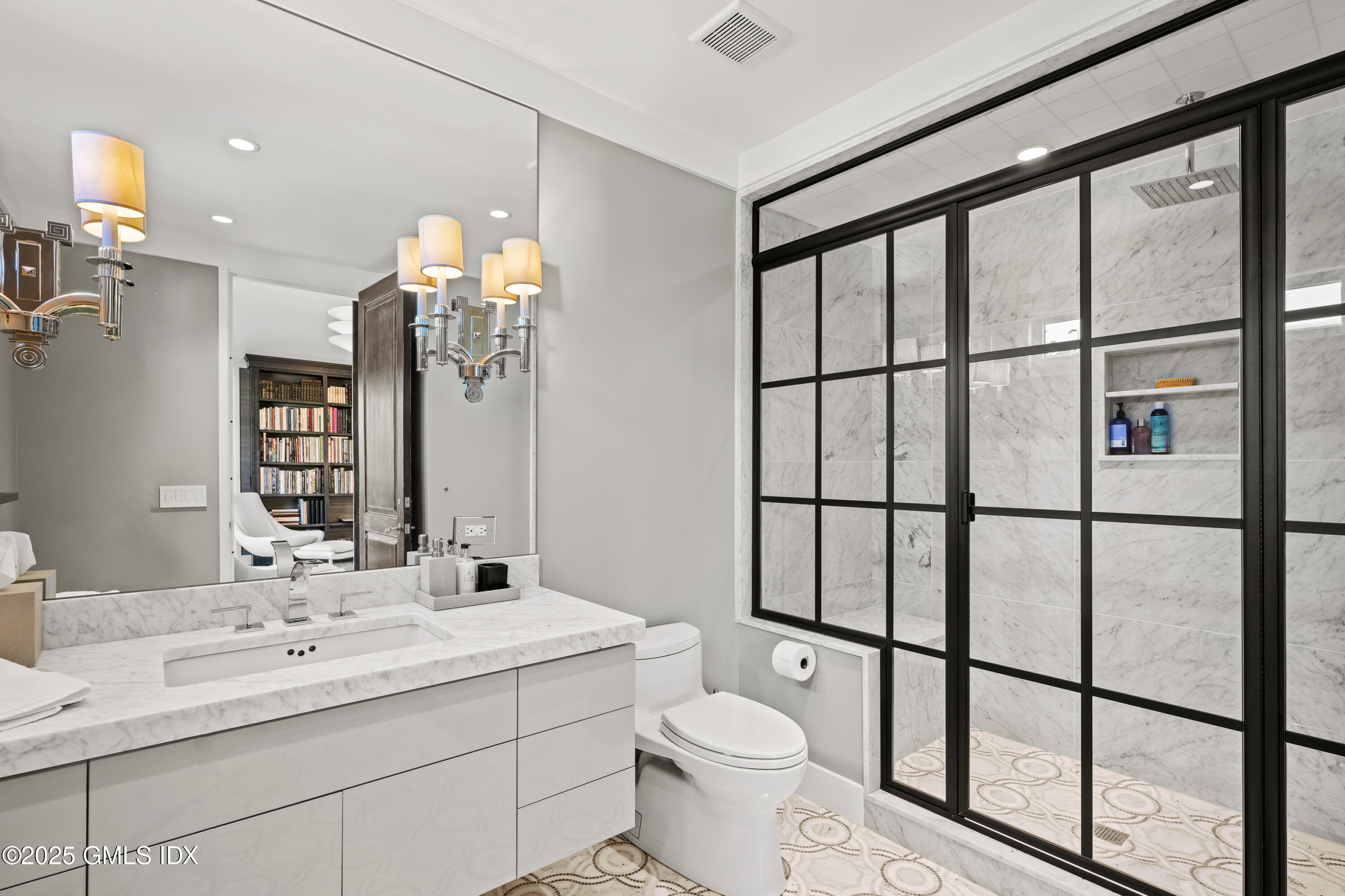 4800 Congress Street Fairfield, CT 06824 - Photo 19 of 37 a bathroom with a double vanity sink toilet and a mirror