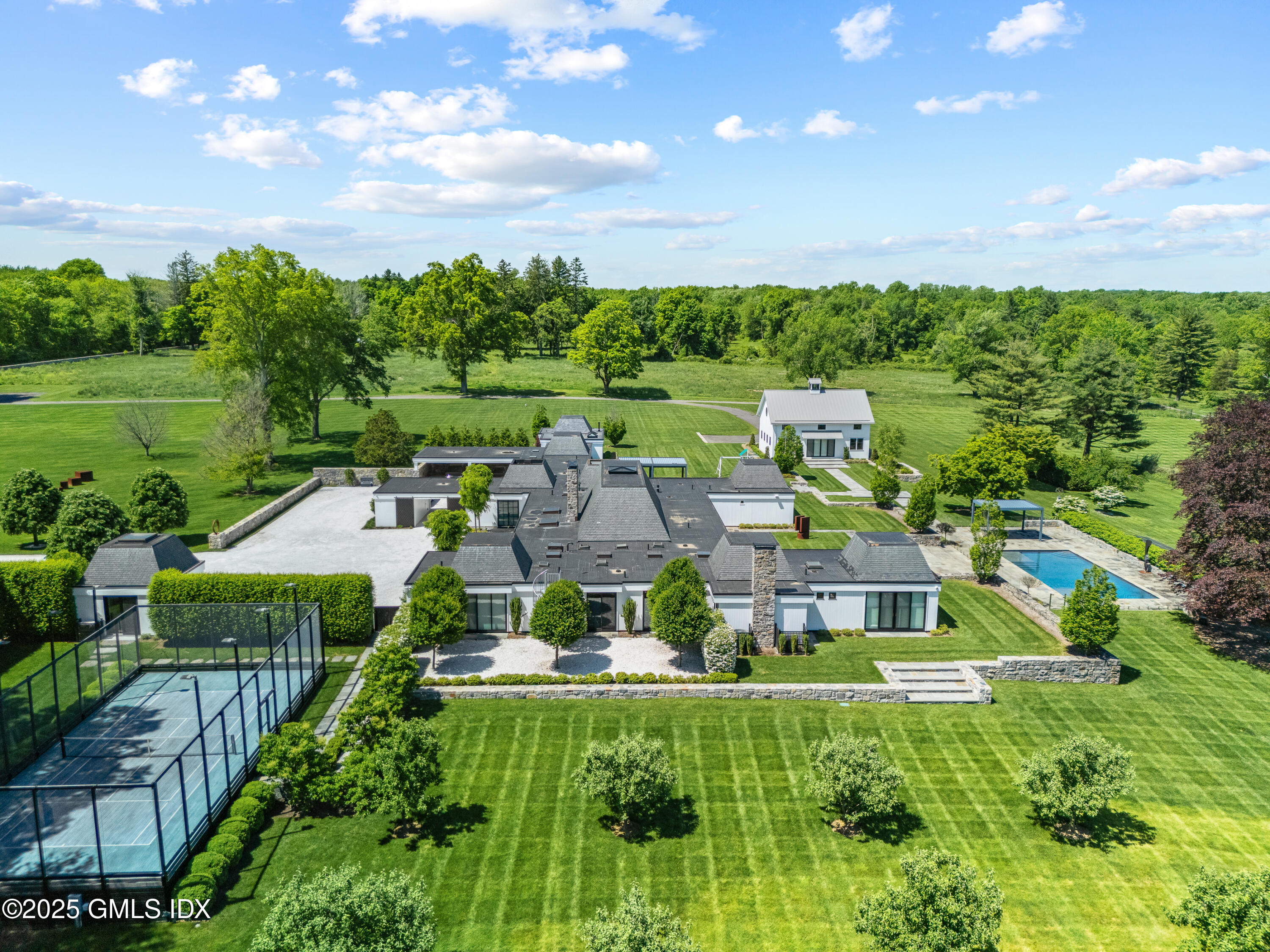 4800 Congress Street Fairfield, CT 06824 - Photo 2 of 37 a aerial view of a house with a garden
