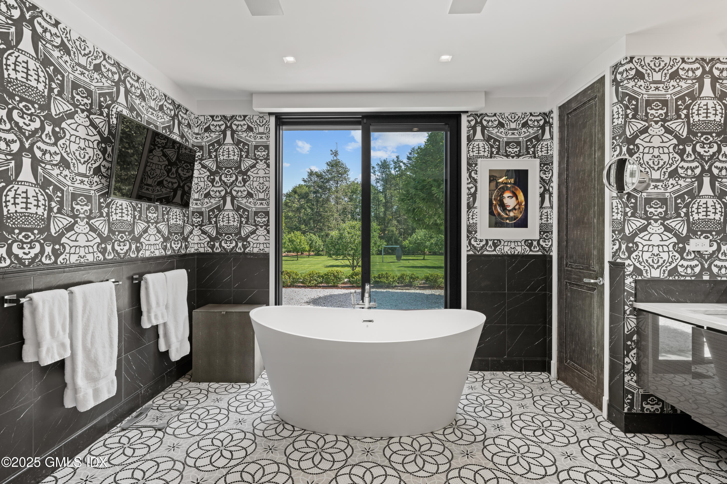 4800 Congress Street Fairfield, CT 06824 - Photo 23 of 37 a living room with furniture a flat screen tv and a fireplace