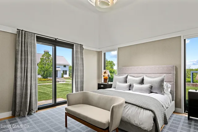 a bedroom with a bed and a couch