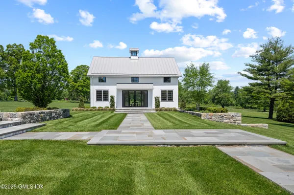 a view of a yard in front of house with a yard