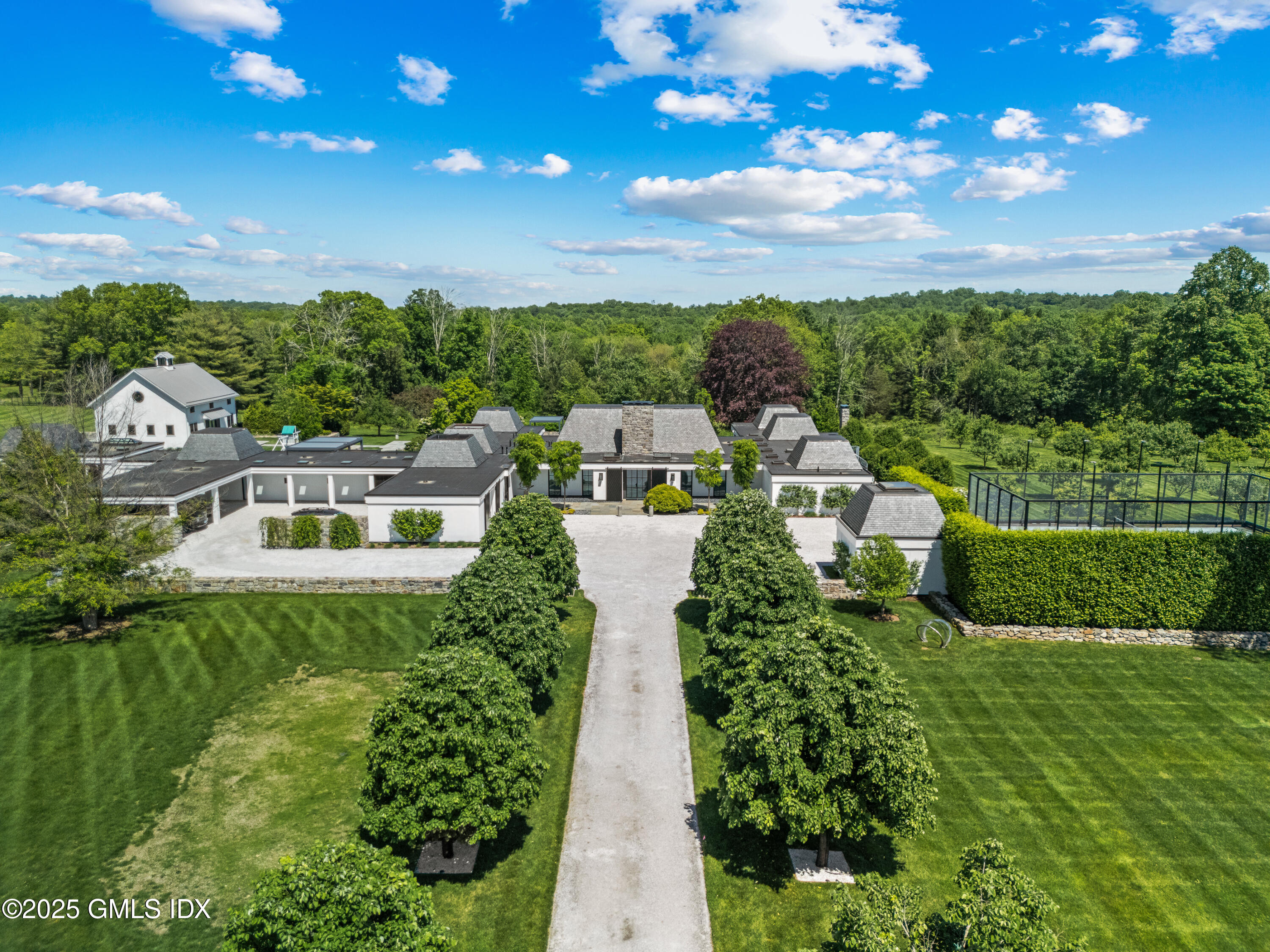 4800 Congress Street Fairfield, CT 06824 - Photo 3 of 37 a front view of a house with a yard