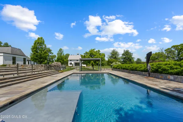 a view of a swimming pool with a patio