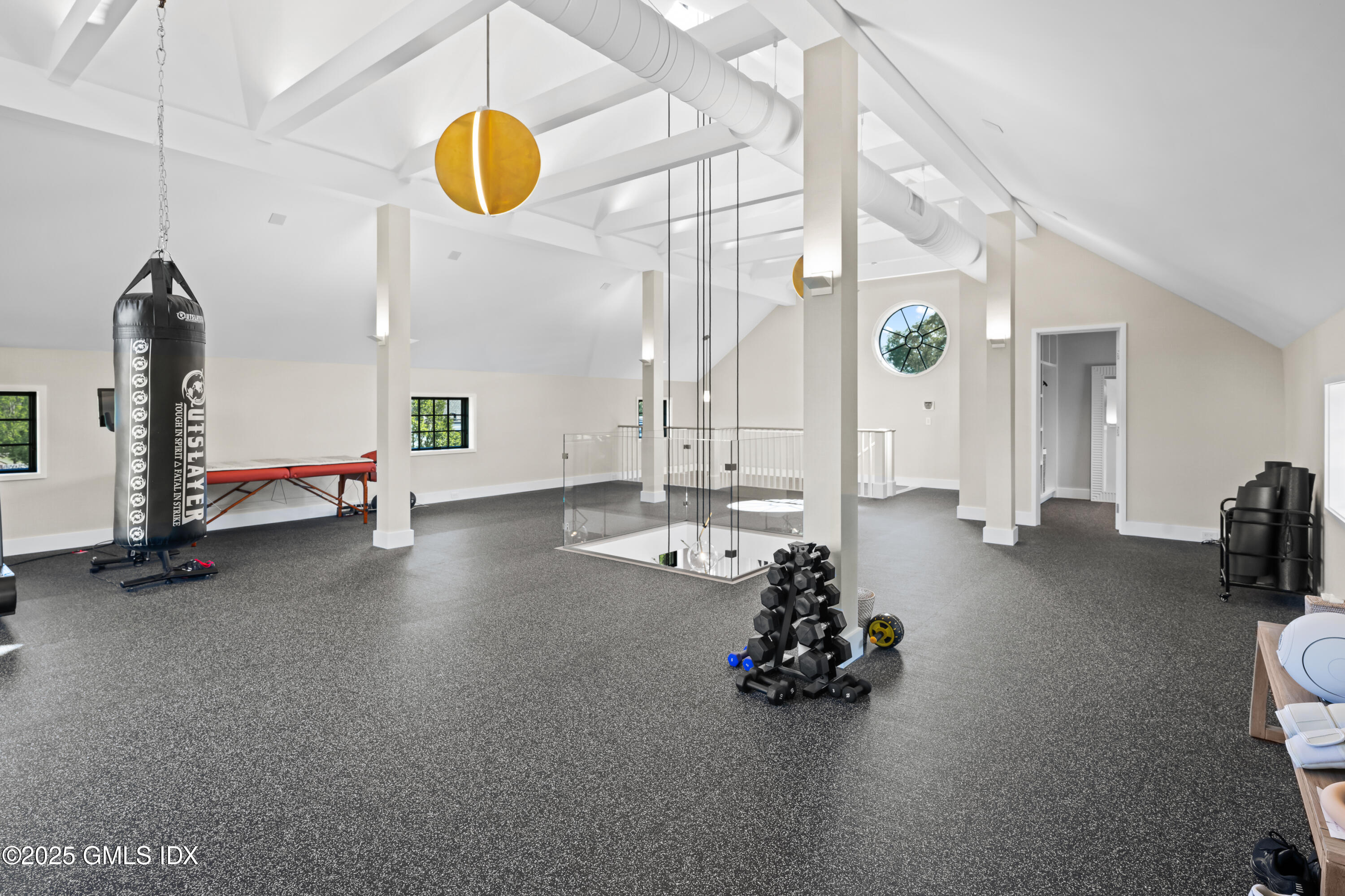 4800 Congress Street Fairfield, CT 06824 - Photo 34 of 37 a room with gym equipment and a large window