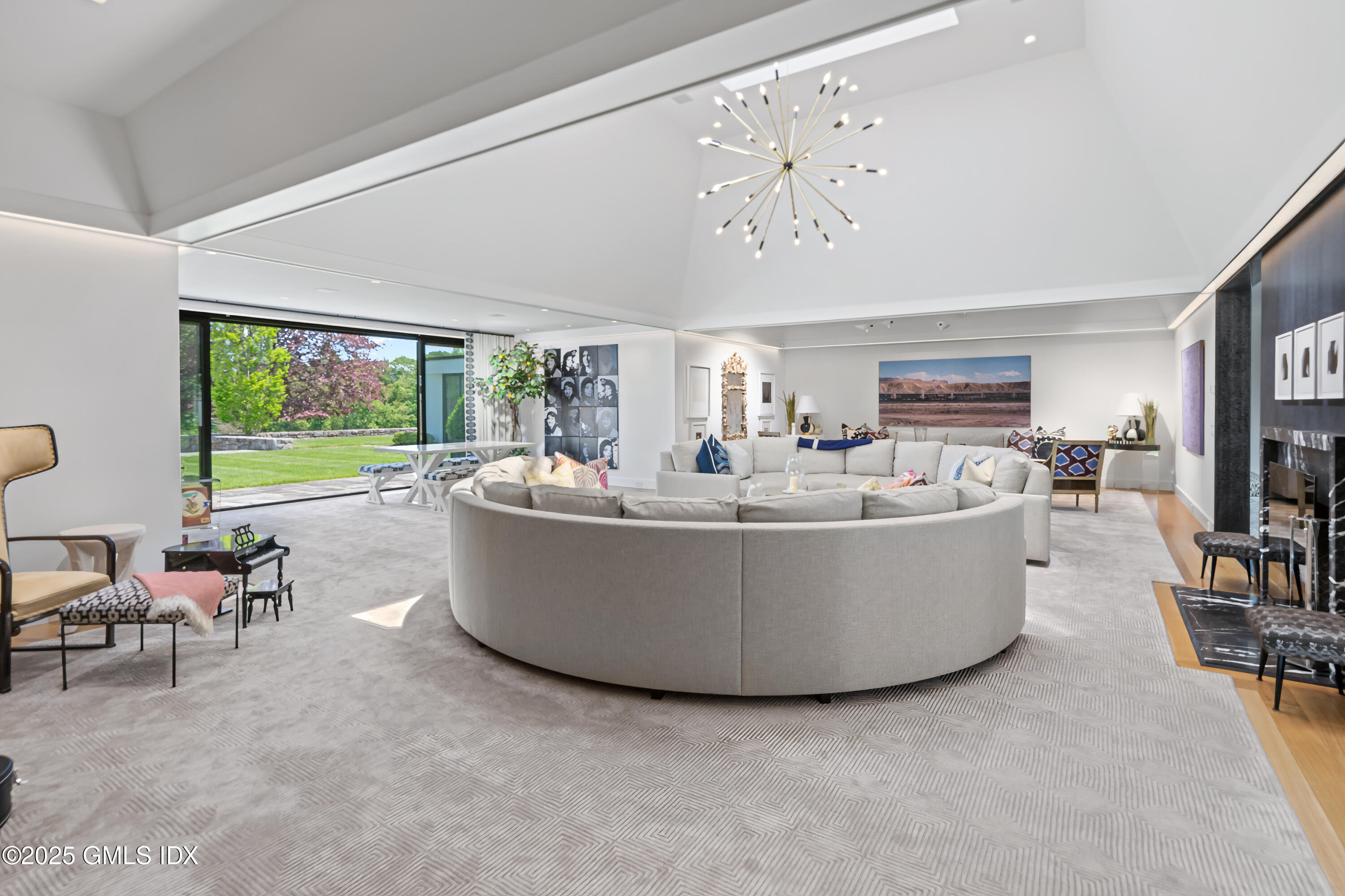4800 Congress Street Fairfield, CT 06824 - Photo 9 of 37 a living room with furniture and a large window