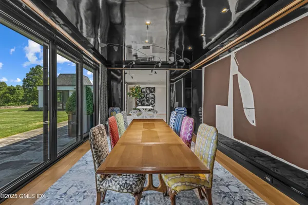 a dining room with a table and chairs