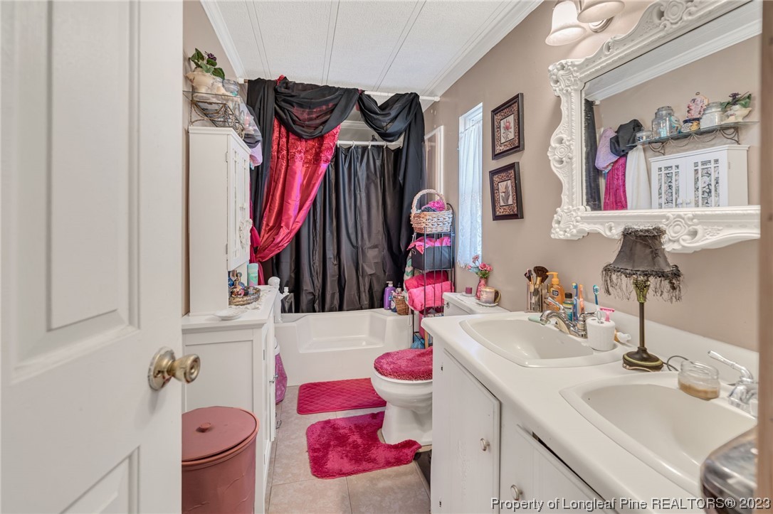 560 Moody Road Cameron, NC 28326 - Photo 13 of 29 a bathroom with a sink vanity and a mirror