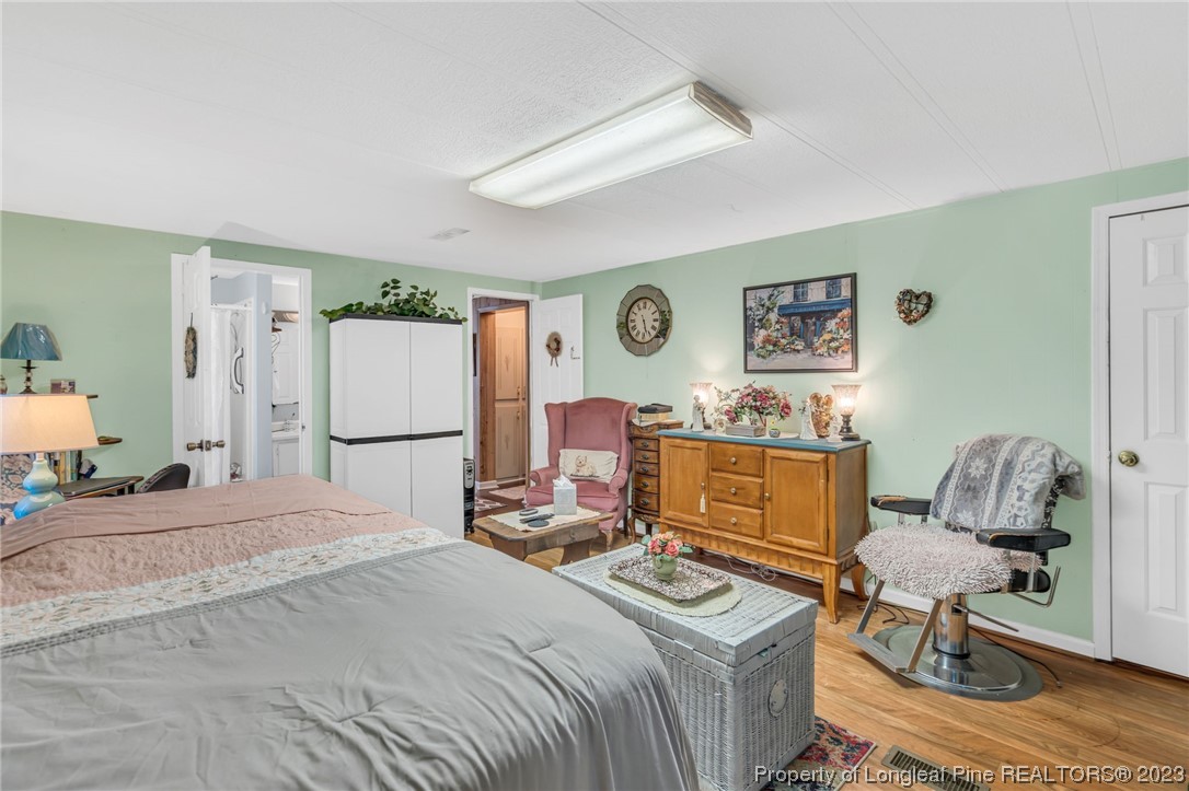 560 Moody Road Cameron, NC 28326 - Photo 15 of 29 a bedroom with a bed and furniture