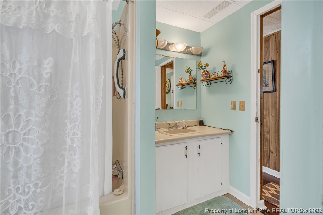 560 Moody Road Cameron, NC 28326 - Photo 16 of 29 a room with cabinets and wooden floor