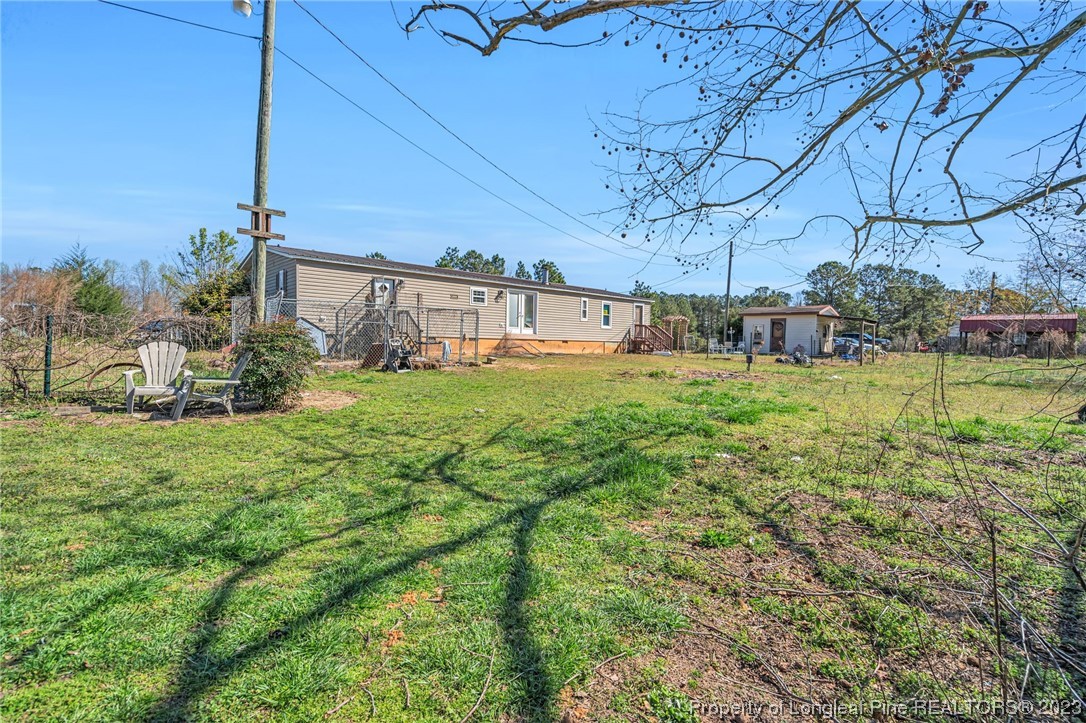 560 Moody Road Cameron, NC 28326 - Photo 20 of 29 a view of a backyard with plants and a patio