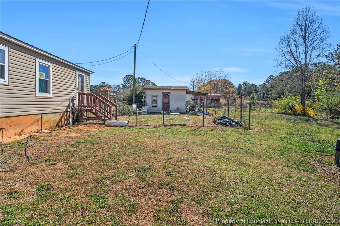 560 Moody Road Cameron, NC 28326 - Photo 23 of 29 a view of a house with a yard