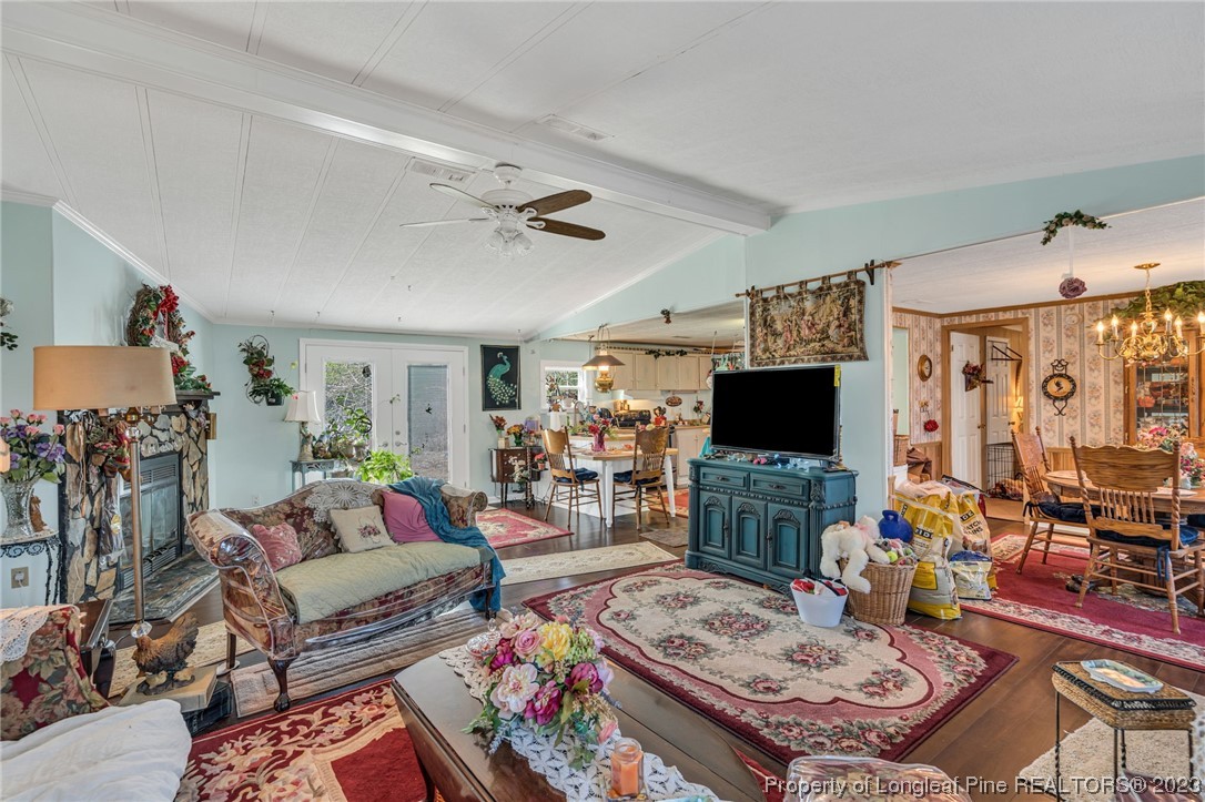 560 Moody Road Cameron, NC 28326 - Photo 3 of 29 a living room with furniture and a flat screen tv