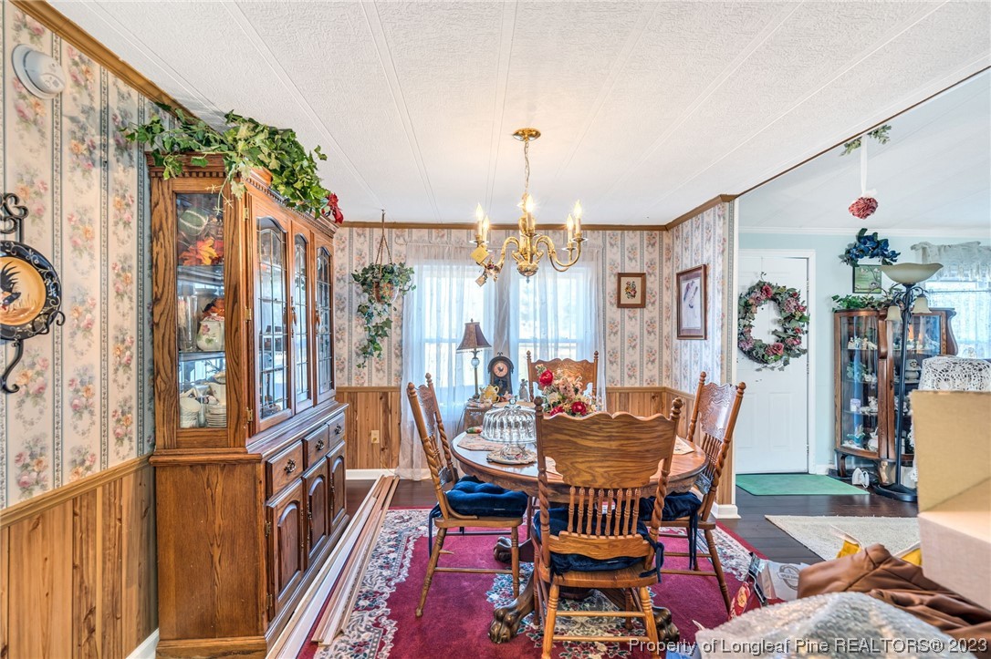 560 Moody Road Cameron, NC 28326 - Photo 5 of 29 a dining room with furniture and wooden floor