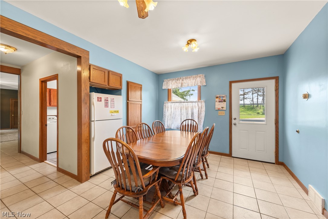 9990 Broadview Road Broadview Heights, OH 44147 - Photo 16 of 47 Dining space with light tile patterned floors and baseboards