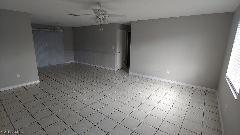 7409 Pebble Beach Road Fort Myers, FL 33967 - Photo 3 of 11 an empty room with windows
