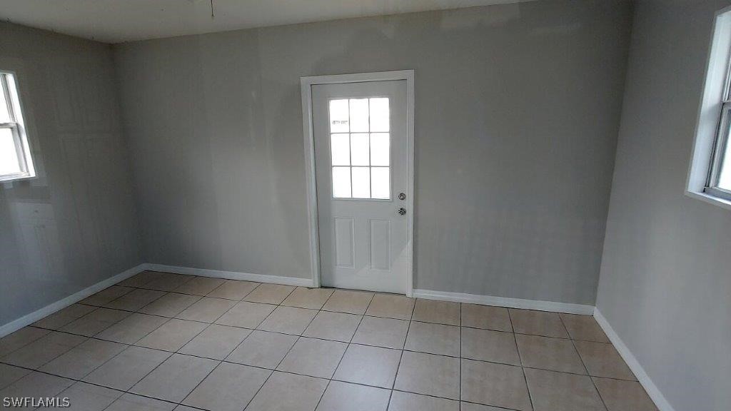 7409 Pebble Beach Road Fort Myers, FL 33967 - Photo 6 of 11 an empty room with windows
