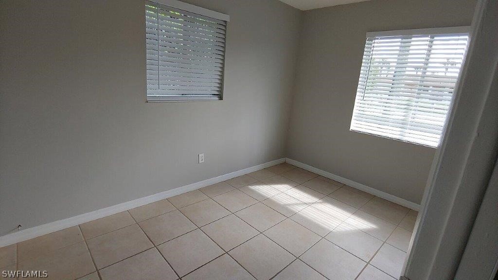 7409 Pebble Beach Road Fort Myers, FL 33967 - Photo 10 of 11 an empty room with a window